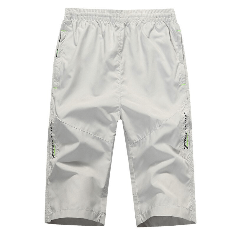 Breathable quick dry men's long shorts with zipper pockets, perfect for summer, featuring micro-bullet elastic waistband and knee-length cut.